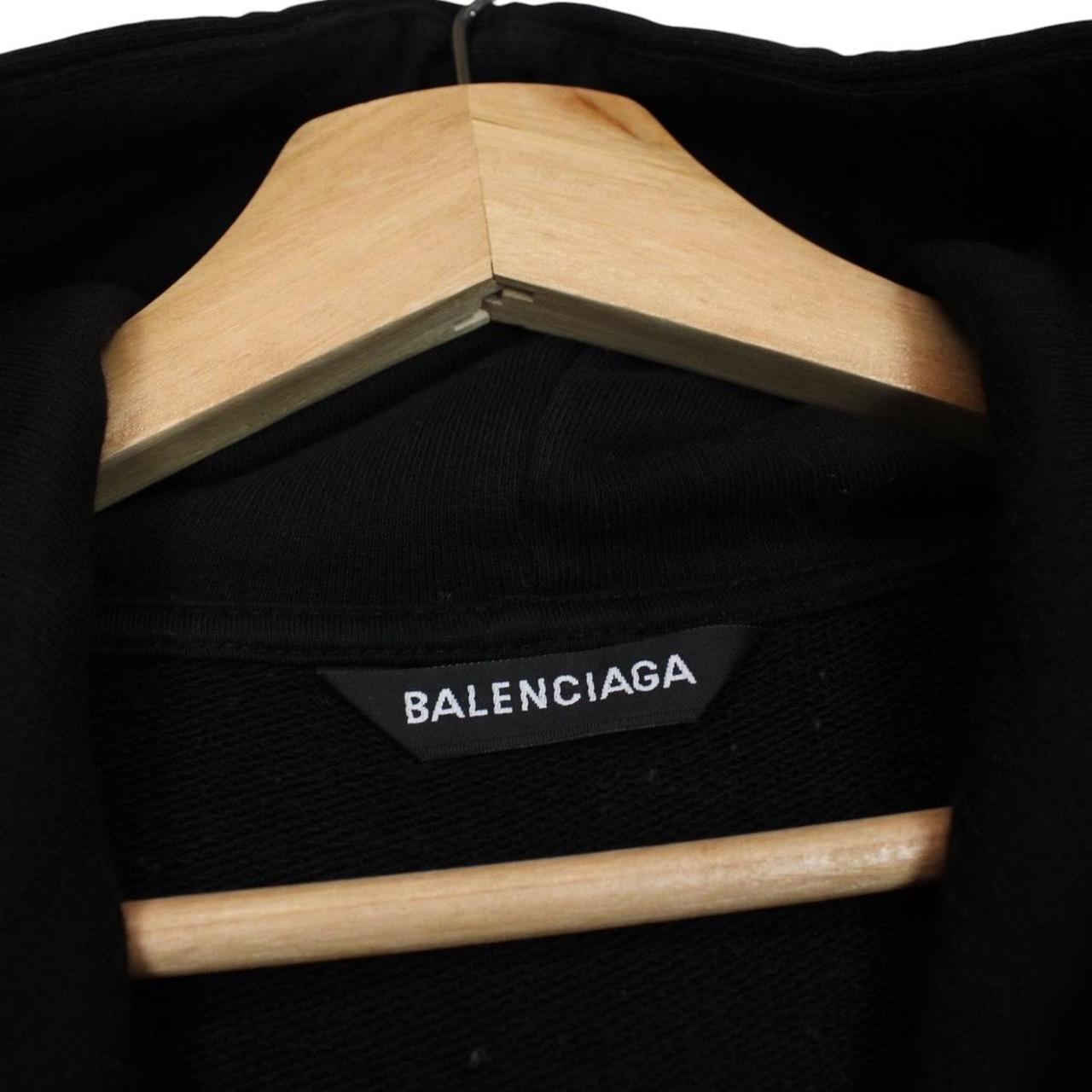Balenciaga black and white cotton hoodie with sponsor logo and large fit.