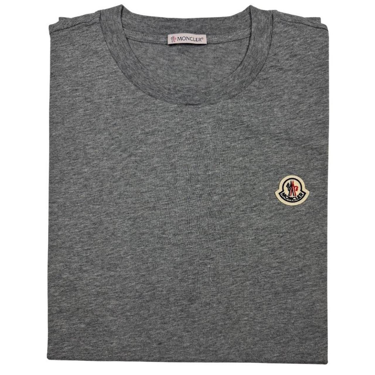 Moncler pocket t-shirts in black, grey, and white with patch logo details.