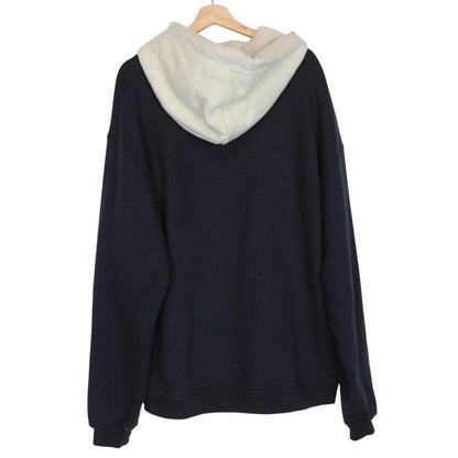 Stone Island beige and navy blue cotton hoodie with logo patch and drawstring hood.