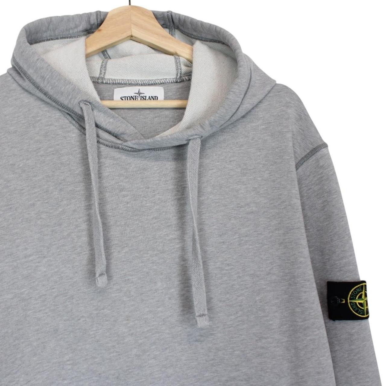 Stone Island grey cotton hoodie with iconic compass logo and drawstring hood.