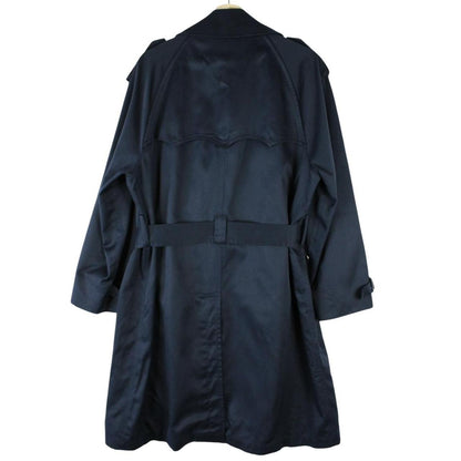 Burberry navy blue double breasted trench coat with belted waist and classic check lining.