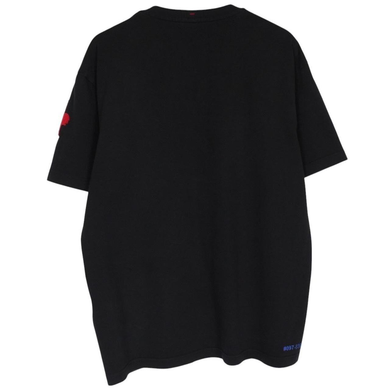 Moncler black and white short sleeve t-shirt with vertical logo design.