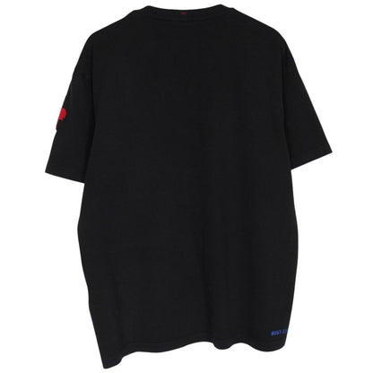 Moncler black and white short sleeve t-shirt with vertical logo design.