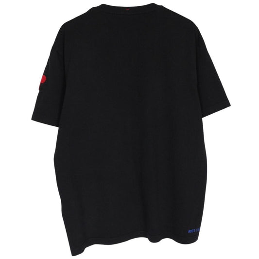 Moncler black and white short sleeve t-shirt with vertical logo design.