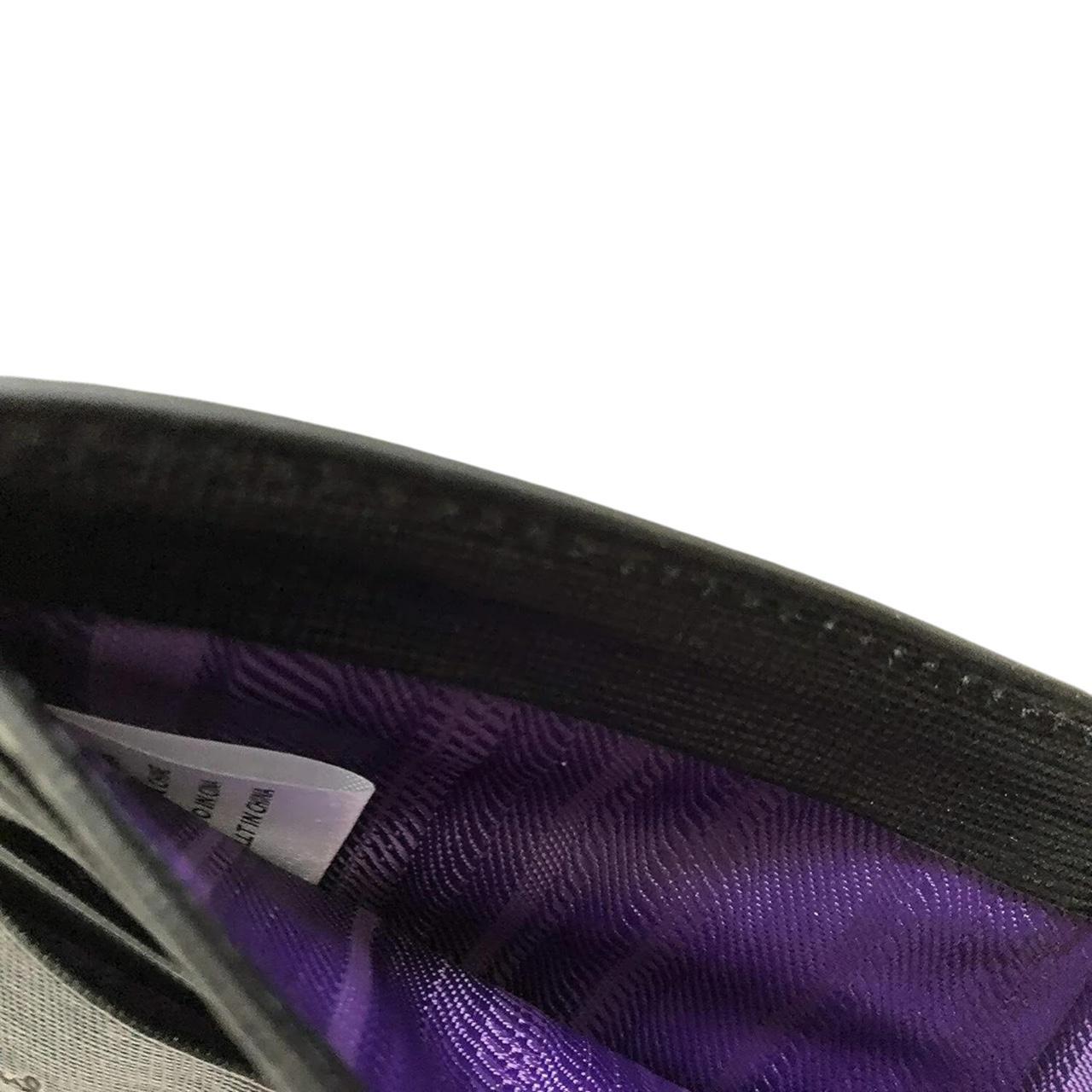 Paul Smith black bifold wallet textured crosshatch leather with logo detail.
