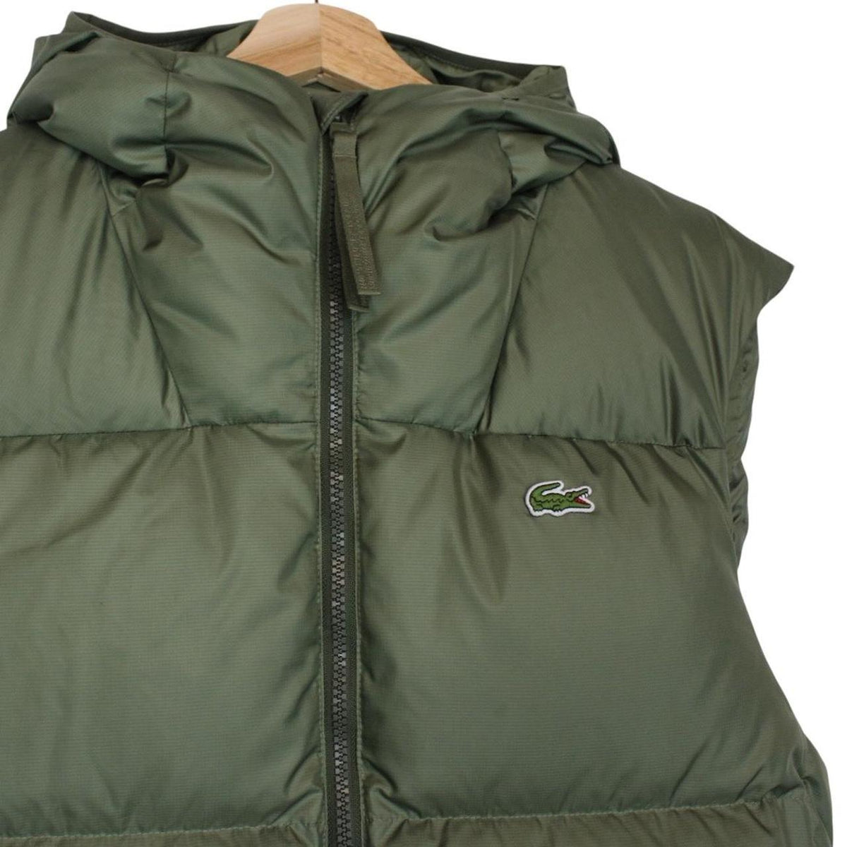 Lacoste khaki green bodywarmer full zip with signature crocodile logo and water-repellent material.