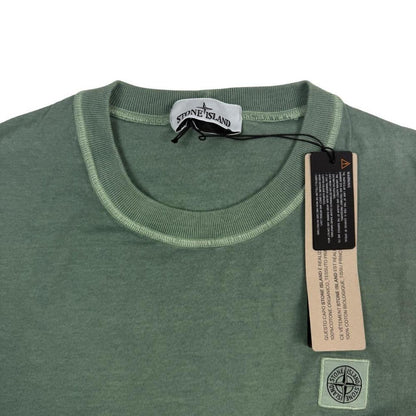 Stone Island green pocket t-shirt with compass logo and fissato effect cotton texture.