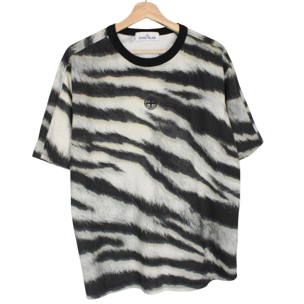 Stone Island short sleeve t-shirt in tiger camo pattern with logo patch on sleeve.