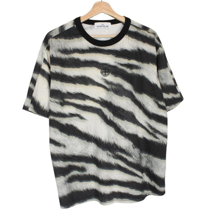 Stone Island short sleeve t-shirt in tiger camo pattern with logo patch on sleeve.