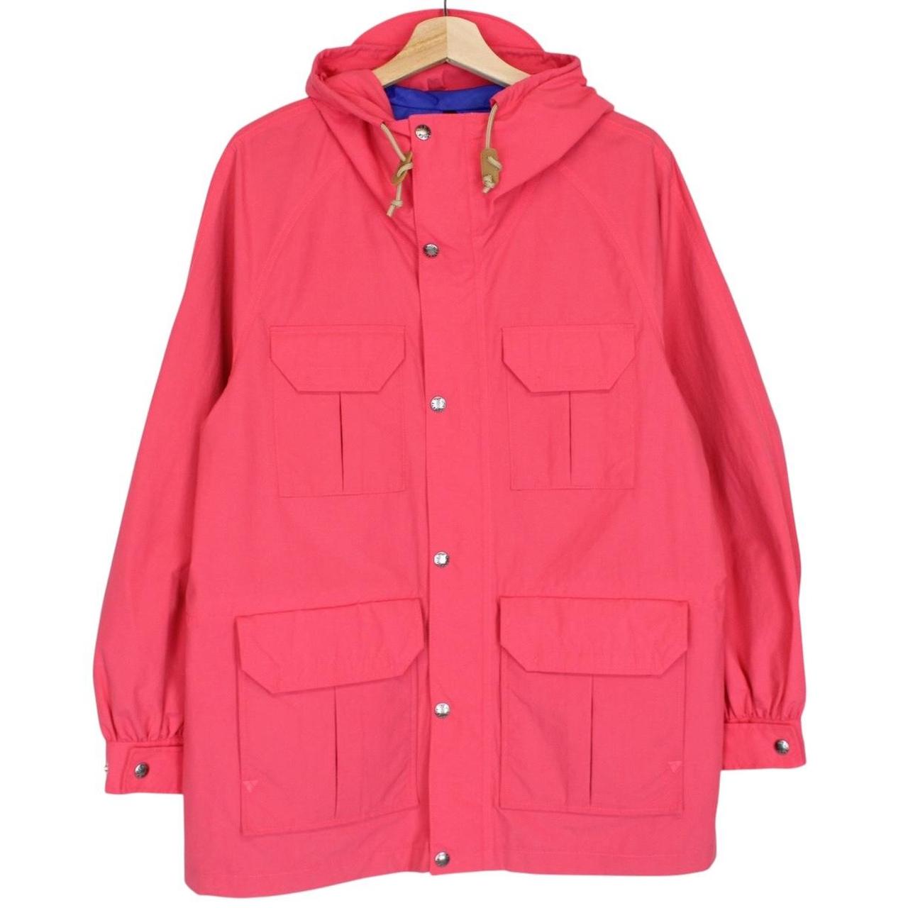 Gucci pink windbreaker jacket with North Face logo and full zip design.