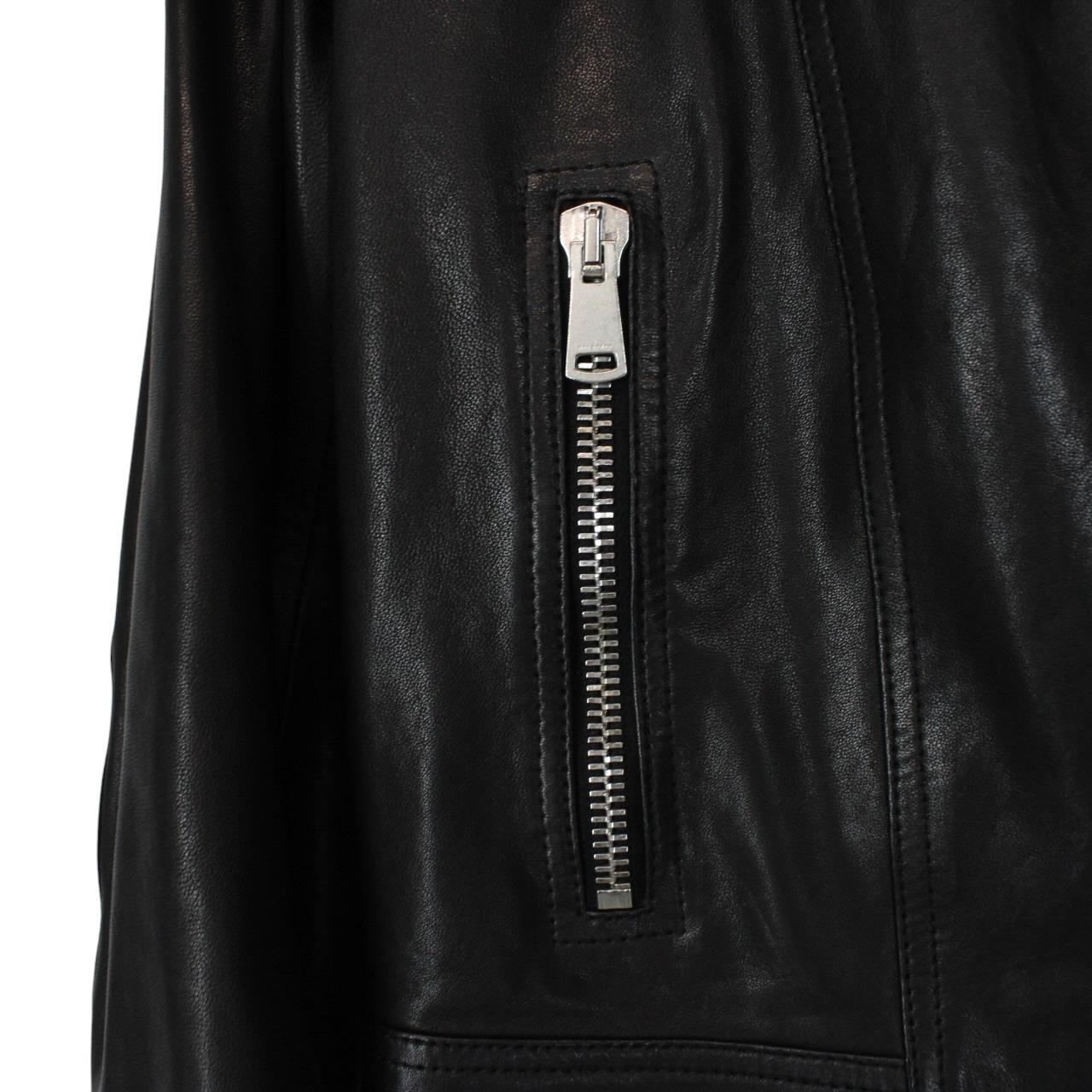 Belstaff black leather biker jacket with detachable coyote fur collar and logo detailing.