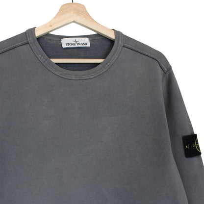 Stone Island grey cotton sweatshirt with embroidered compass logo and slight discolouration.
