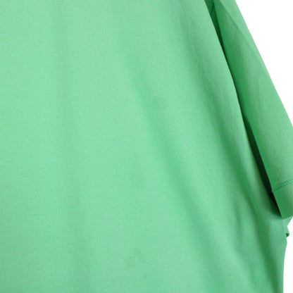 Stone Island green short sleeve cotton t-shirt with compass logo and tag detail.