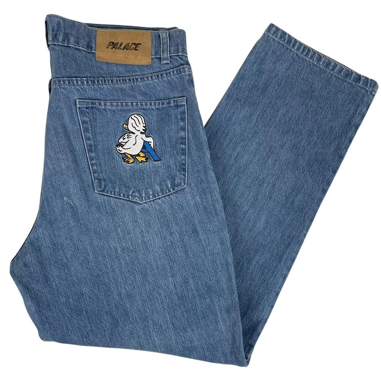 Palace blue straight jeans with mid stone wash and quacked pattern details.