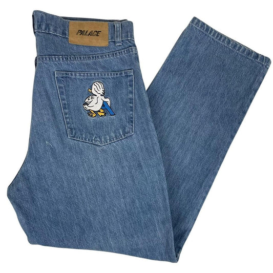 Palace blue straight jeans with mid stone wash and quacked pattern details.