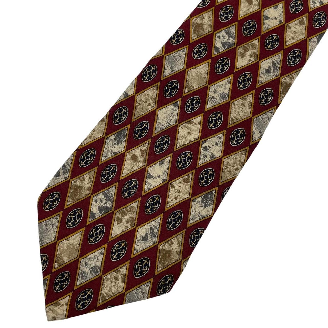 Christian Dior cream silk tie with multicoloured abstract print and logo detail.