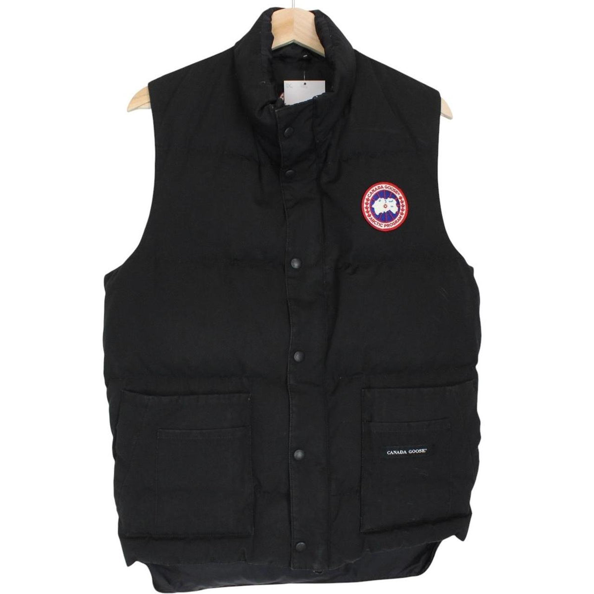Canada Goose black down gilet with logo patch and durable exterior shell.