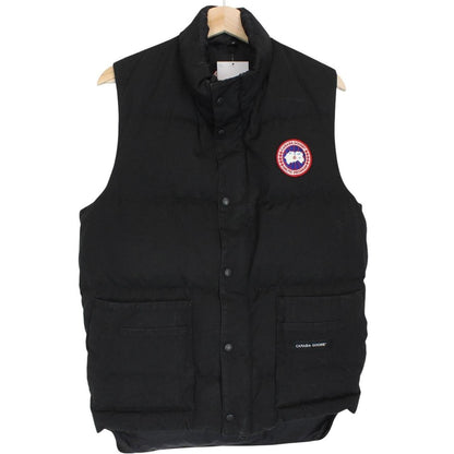 Canada Goose black down gilet with logo patch and durable exterior shell.