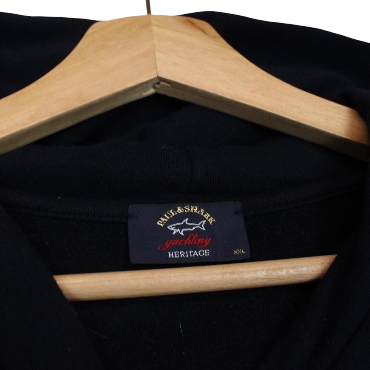 Paul & Shark navy blue hoodie with embroidered logo and cotton material.