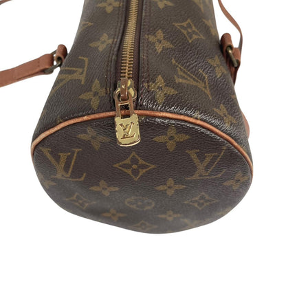 Louis Vuitton duffel bag brown and tan monogram canvas with logo pattern and wear.