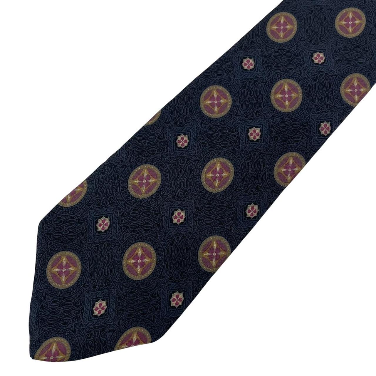 Yves Saint Laurent navy blue silk tie with abstract print design.