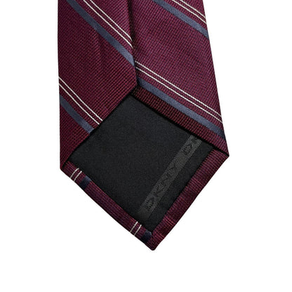 DKNY plum purple silk tie with a smooth finish and vintage design.