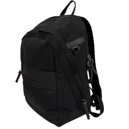 Moncler black duffel bag with logo patch and durable material, pre-loved condition.