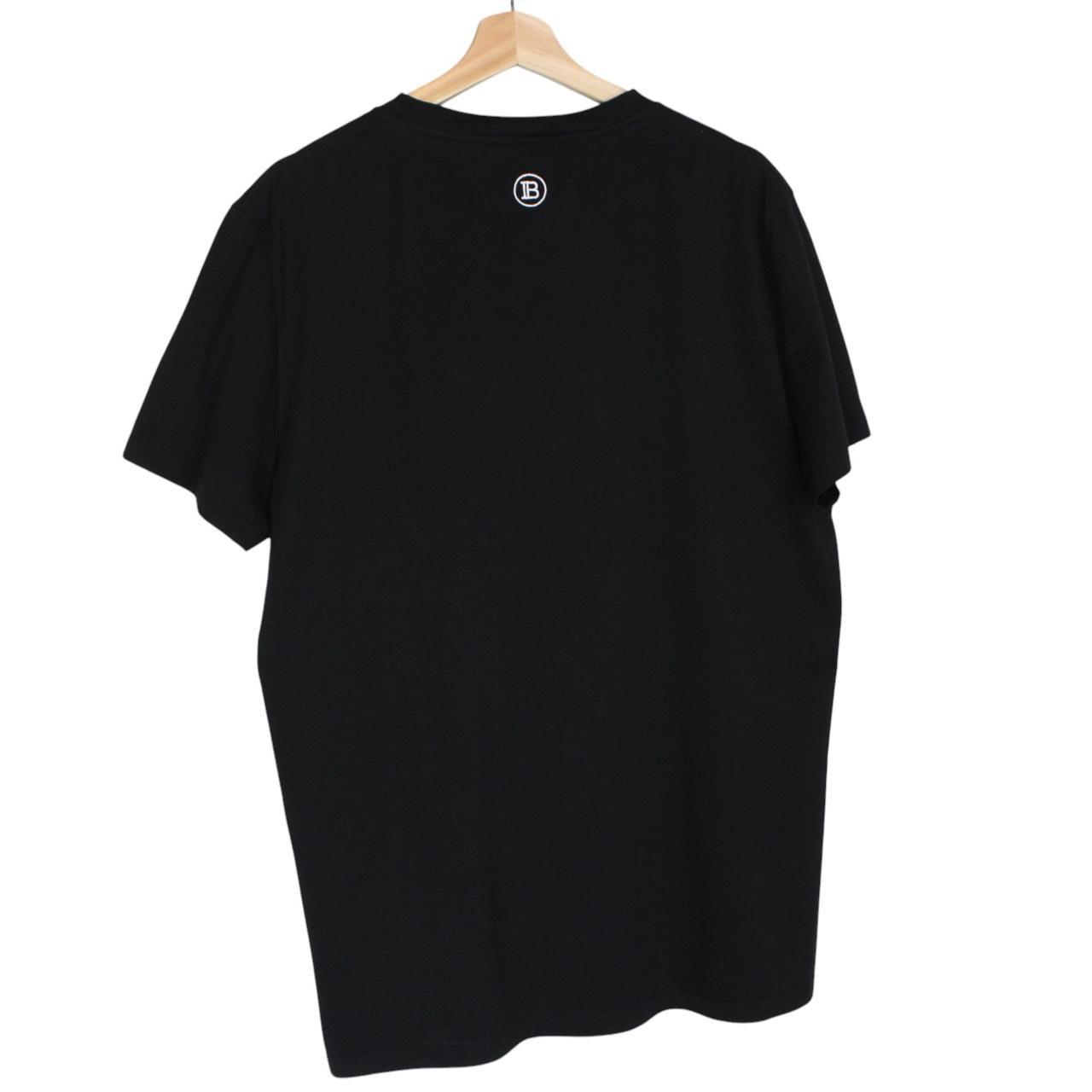 Balmain black pocket t-shirt with white embroidered logo and short sleeves.