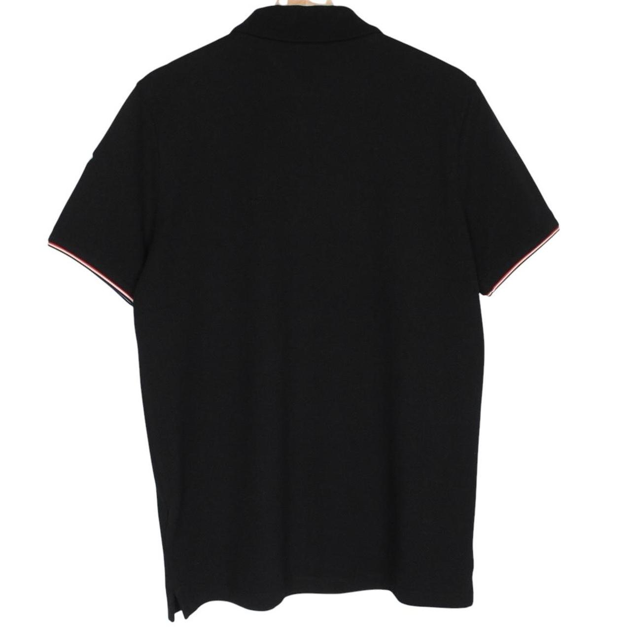 Moncler black short sleeve polo shirt with embroidered logo and cotton material.
