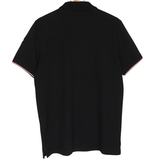 Moncler black short sleeve polo shirt with embroidered logo and cotton material.
