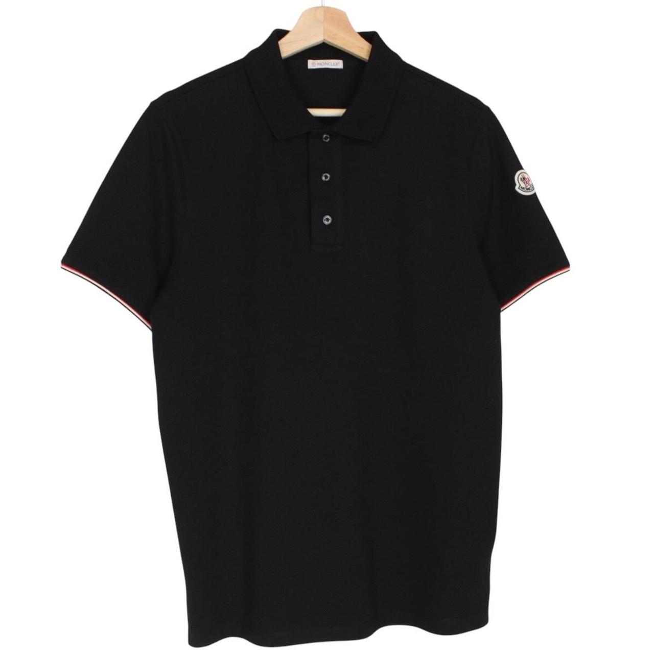 Moncler black short sleeve polo shirt with embroidered logo and cotton material.