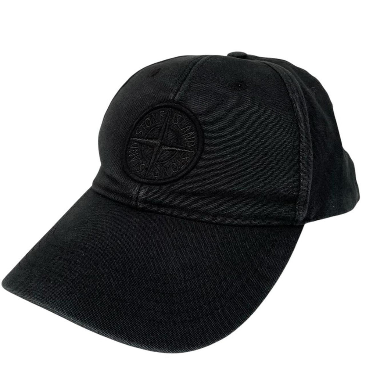 Stone Island black baseball cap with embroidered compass logo and cotton material.