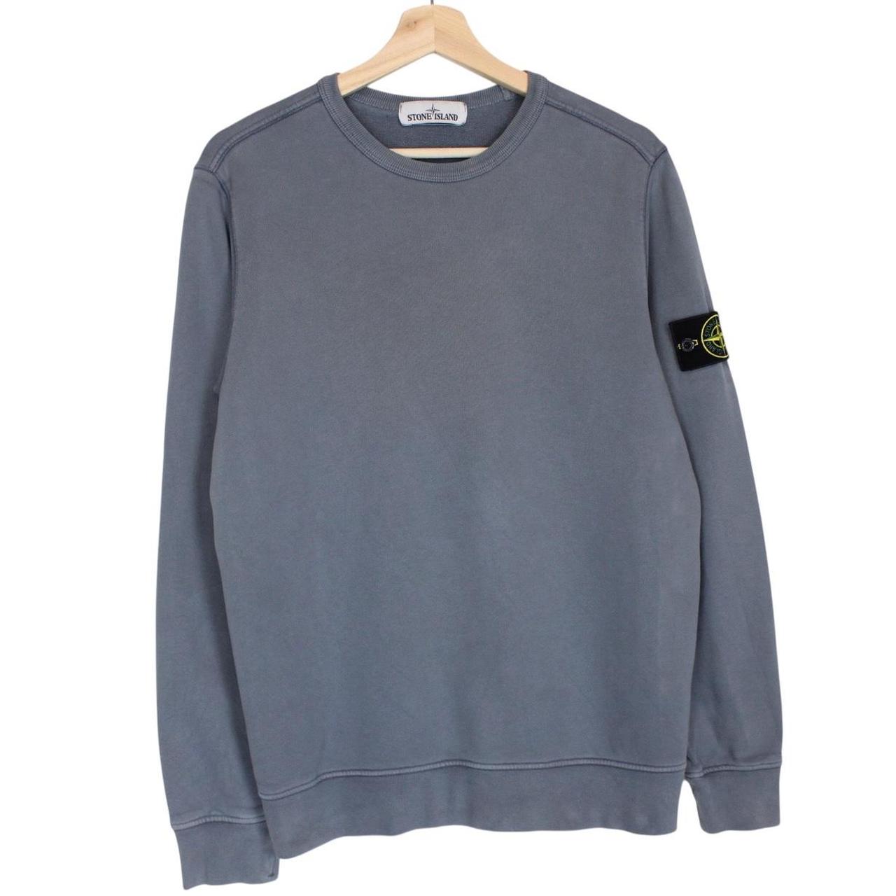 Stone Island blue cotton sweatshirt with iconic compass logo and ribbed cuffs.