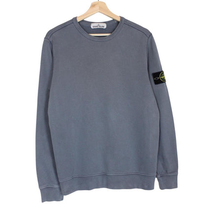 Stone Island blue cotton sweatshirt with iconic compass logo and ribbed cuffs.