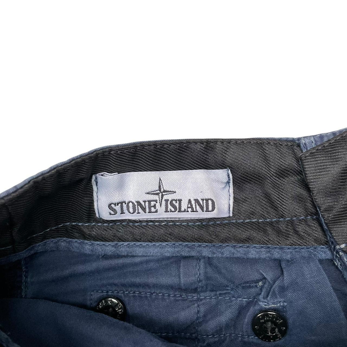 Stone Island navy blue cargo shorts with iconic compass logo and cotton material.