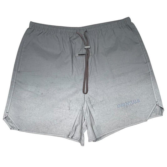 Essentials silver reflective nylon shorts with logo detail and sleek design.