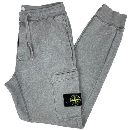 Stone Island grey joggers with logo patch and cotton material, size small.