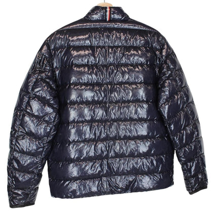 Moncler navy blue full zip down jacket with logo patch and quilted material.