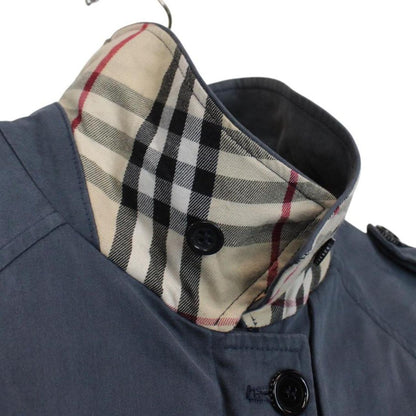 Burberry blue Harrington jacket with Nova Check lining and faint stains on sleeve.