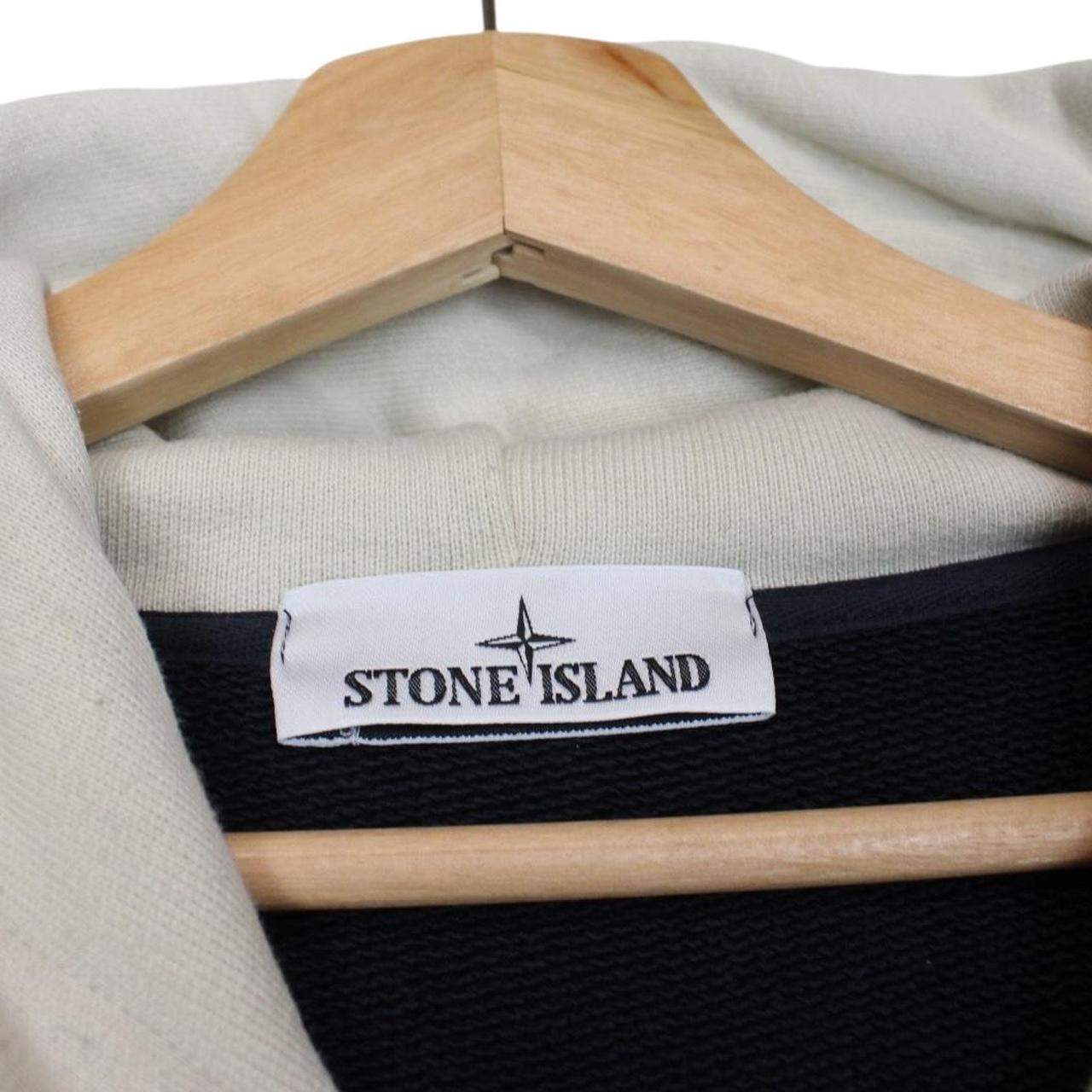 Stone Island beige and navy blue cotton hoodie with logo patch and drawstring hood.