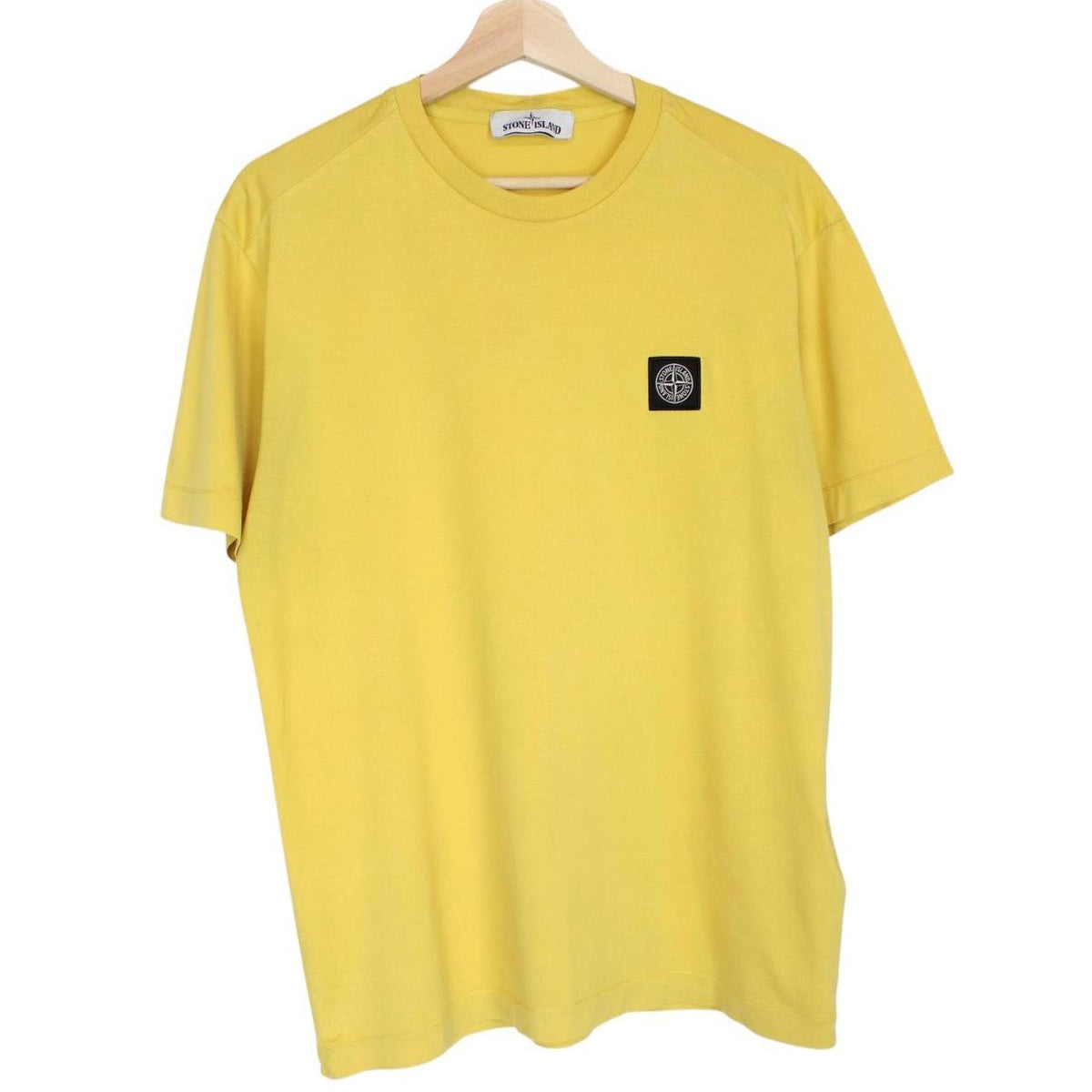 Stone Island yellow short sleeve cotton t-shirt with compass logo and soft fabric.