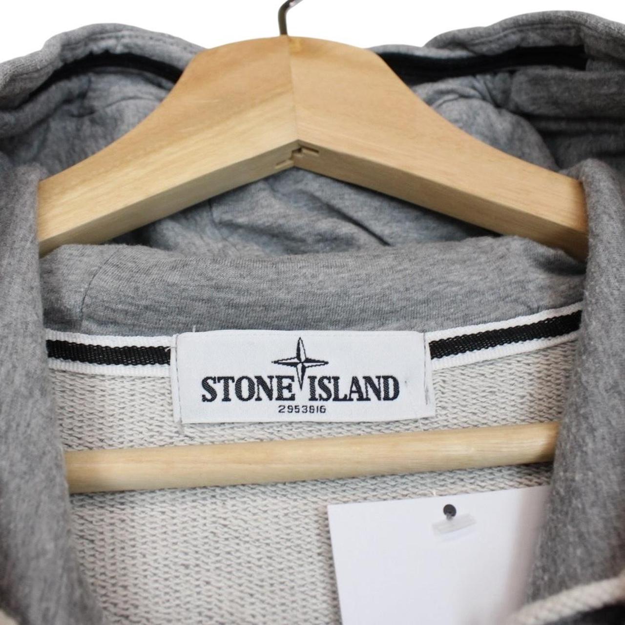 Stone Island grey cotton hoodie with iconic compass logo and drawstring hood.