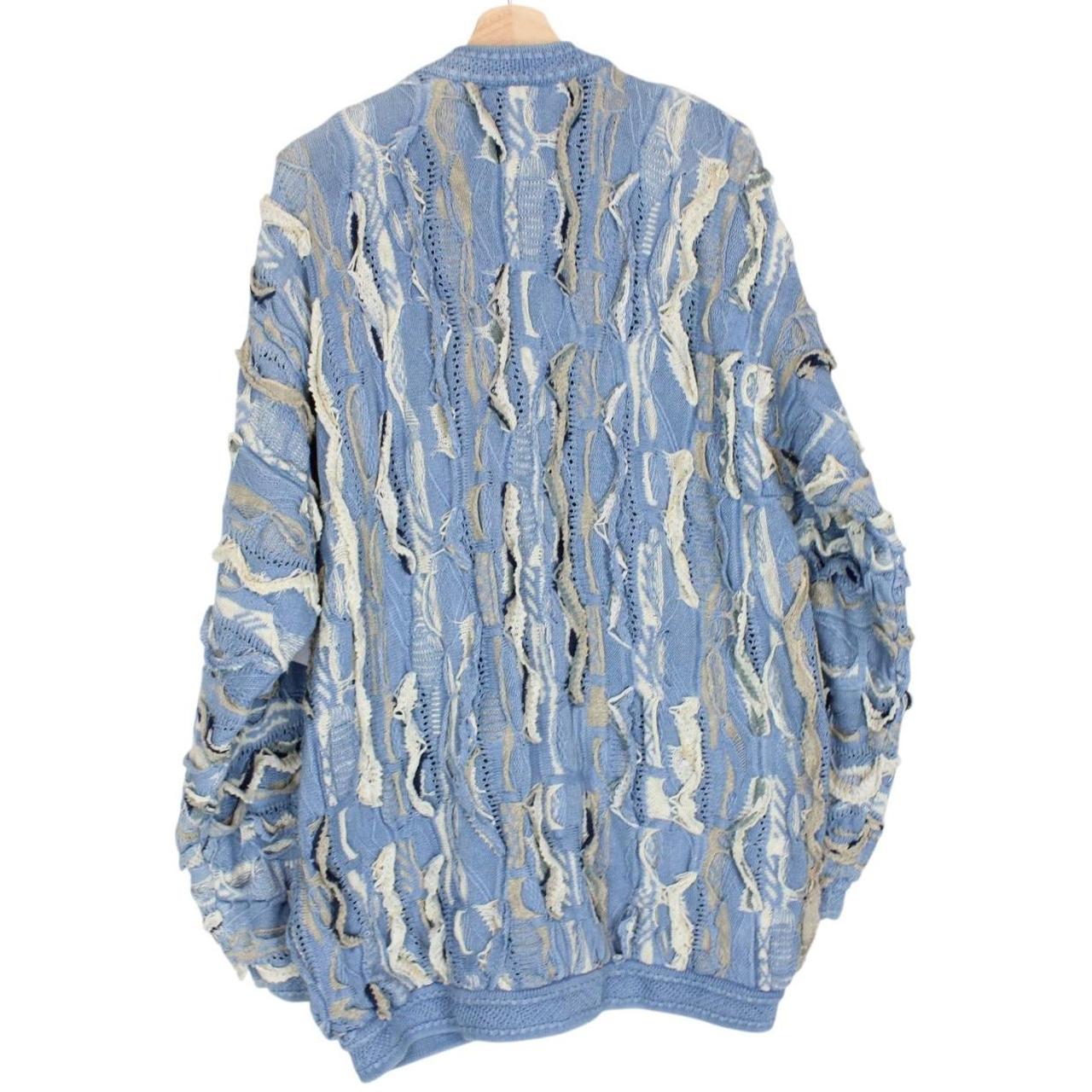 Coogi blue cotton knit full zip cardigan with signature colorful pattern and logo.