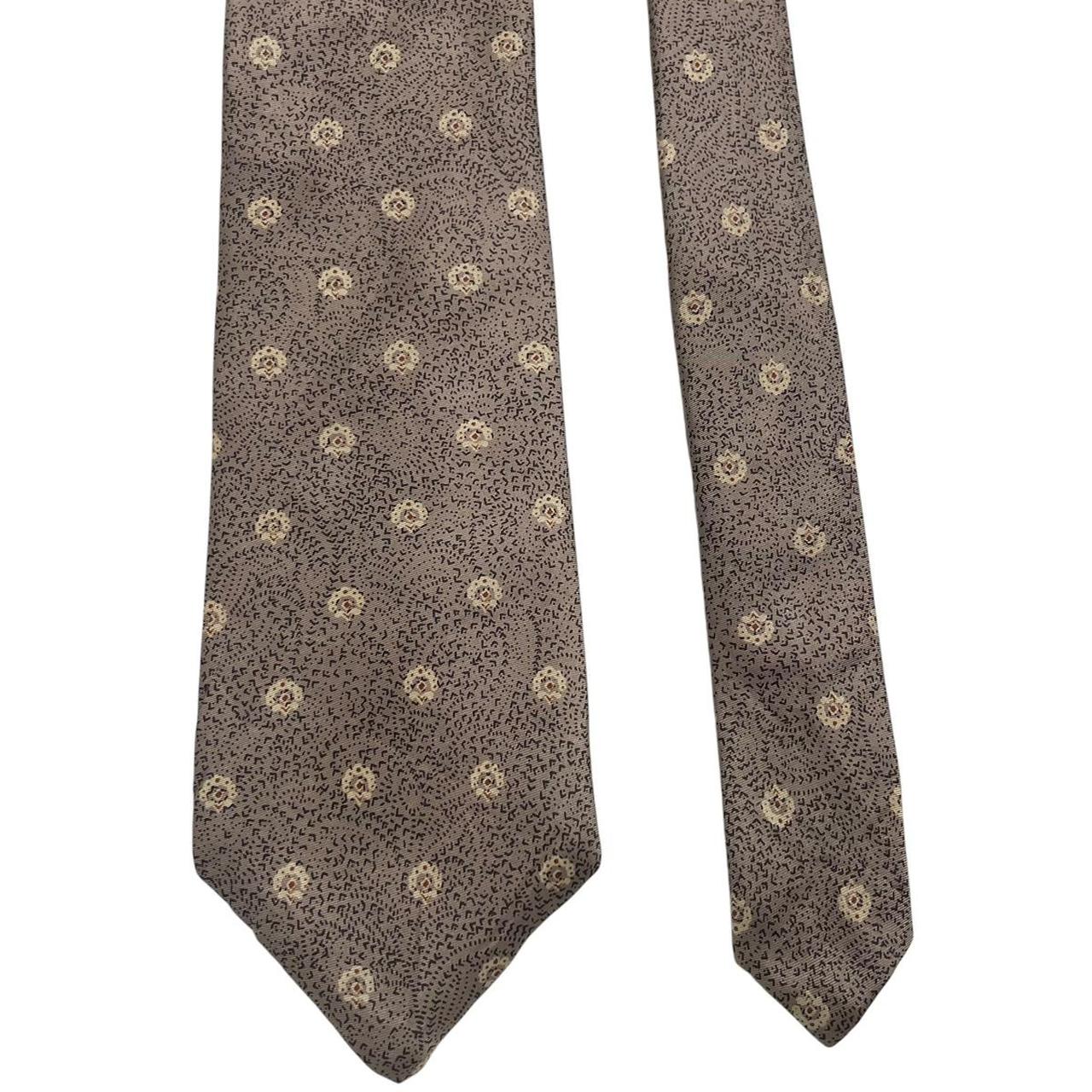 Christian Dior brown silk tie with subtle sheen and classic design elements.