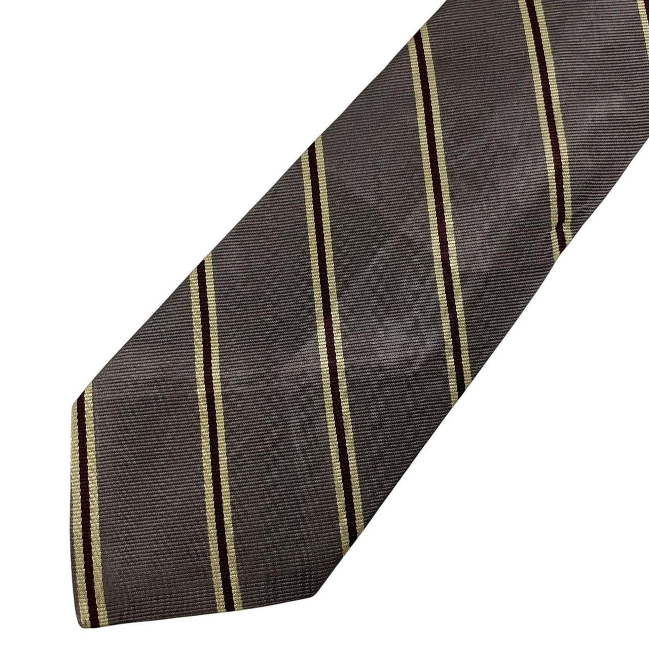 Polo Ralph Lauren grey silk tie with Neiman Marcus label and smooth texture.