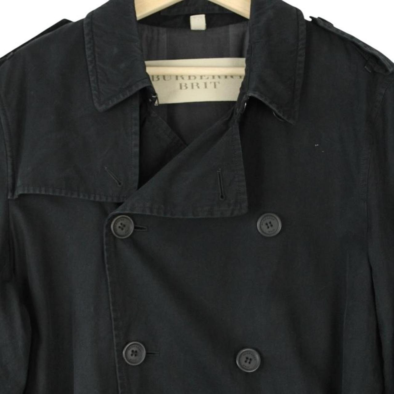 Burberry black trench coat with Nova Check pattern and double-breasted design.