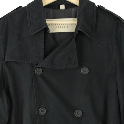 Burberry black trench coat with Nova Check pattern and double-breasted design.