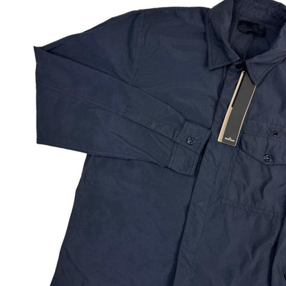 Stone Island navy blue nylon overshirt jacket with ghost logo and smooth texture.