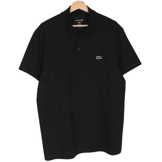 Lacoste black short sleeve polo shirt with embroidered crocodile logo, made of cotton.