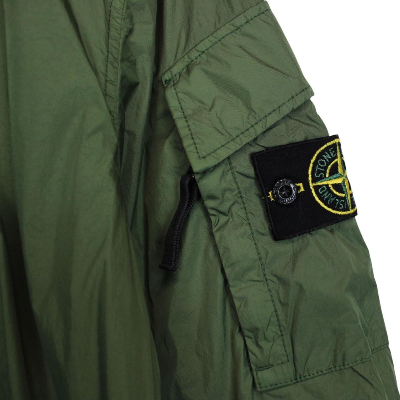 Stone Island green nylon overshirt jacket with full zip and compass logo patch.